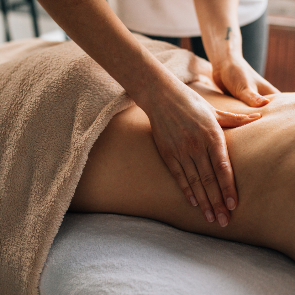 Person receiving relaxing back massage therapy