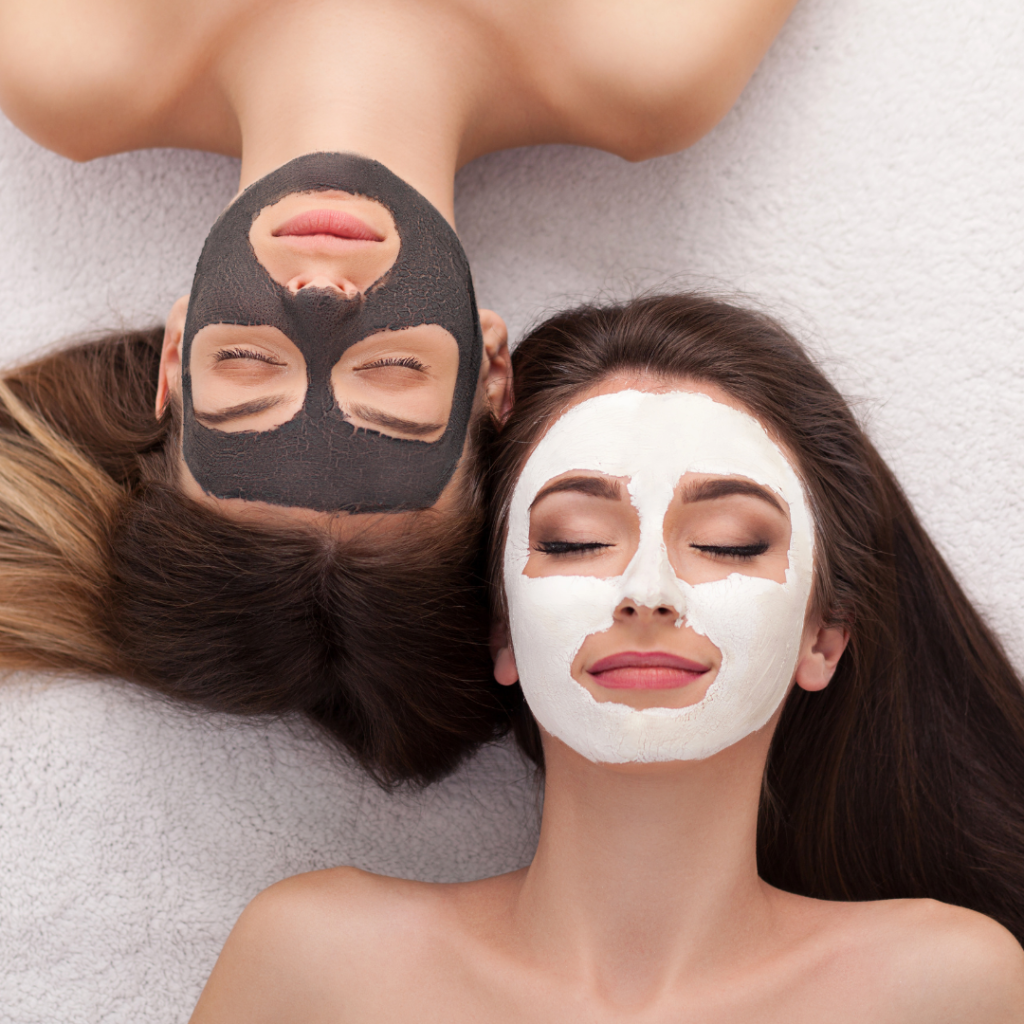 Two women relaxing with facial masks.